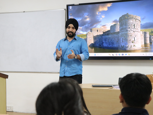 speaker presenting slides